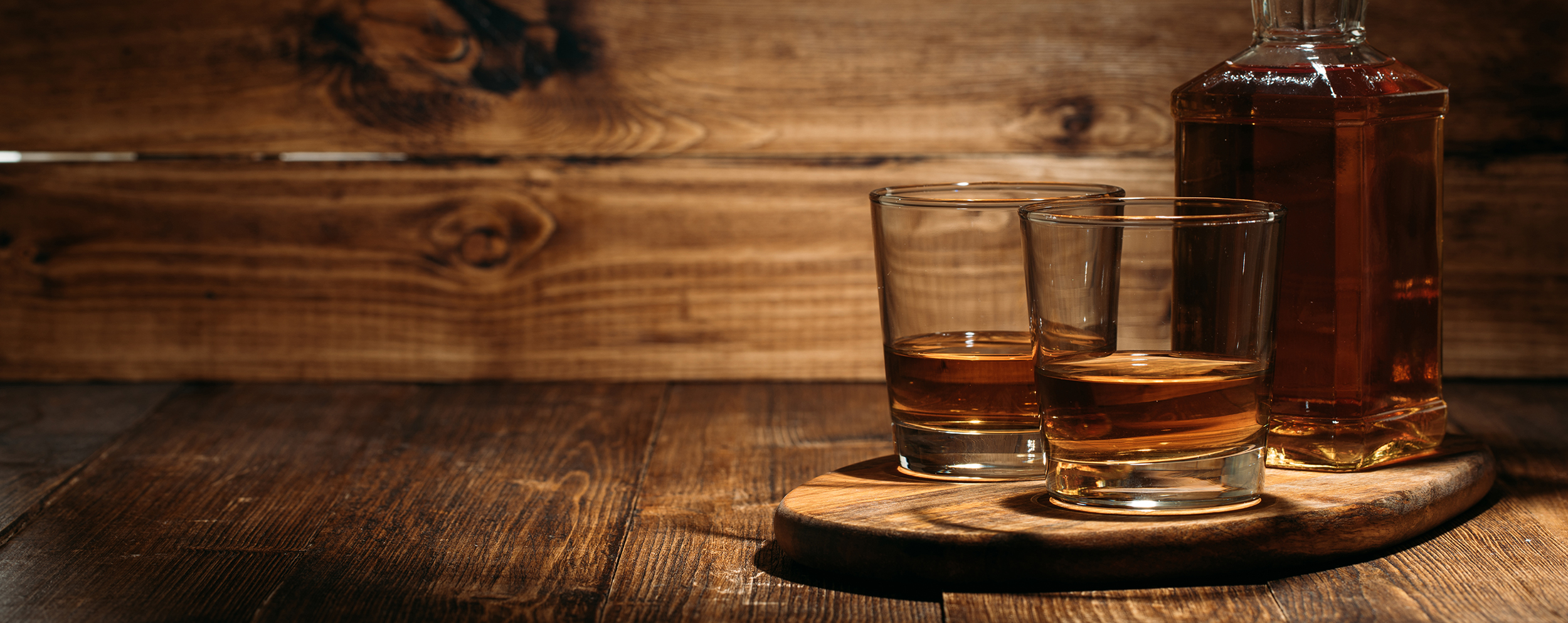 Glass of rum with ice cubes